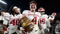 West Lafayette, Indiana, USA; Indiana Hoosiers linebacker Aiden Fisher (4) holds the Old Oaken Bucket trophy after the game against the Purdue Boilermakers at Ross-Ade Stadium.