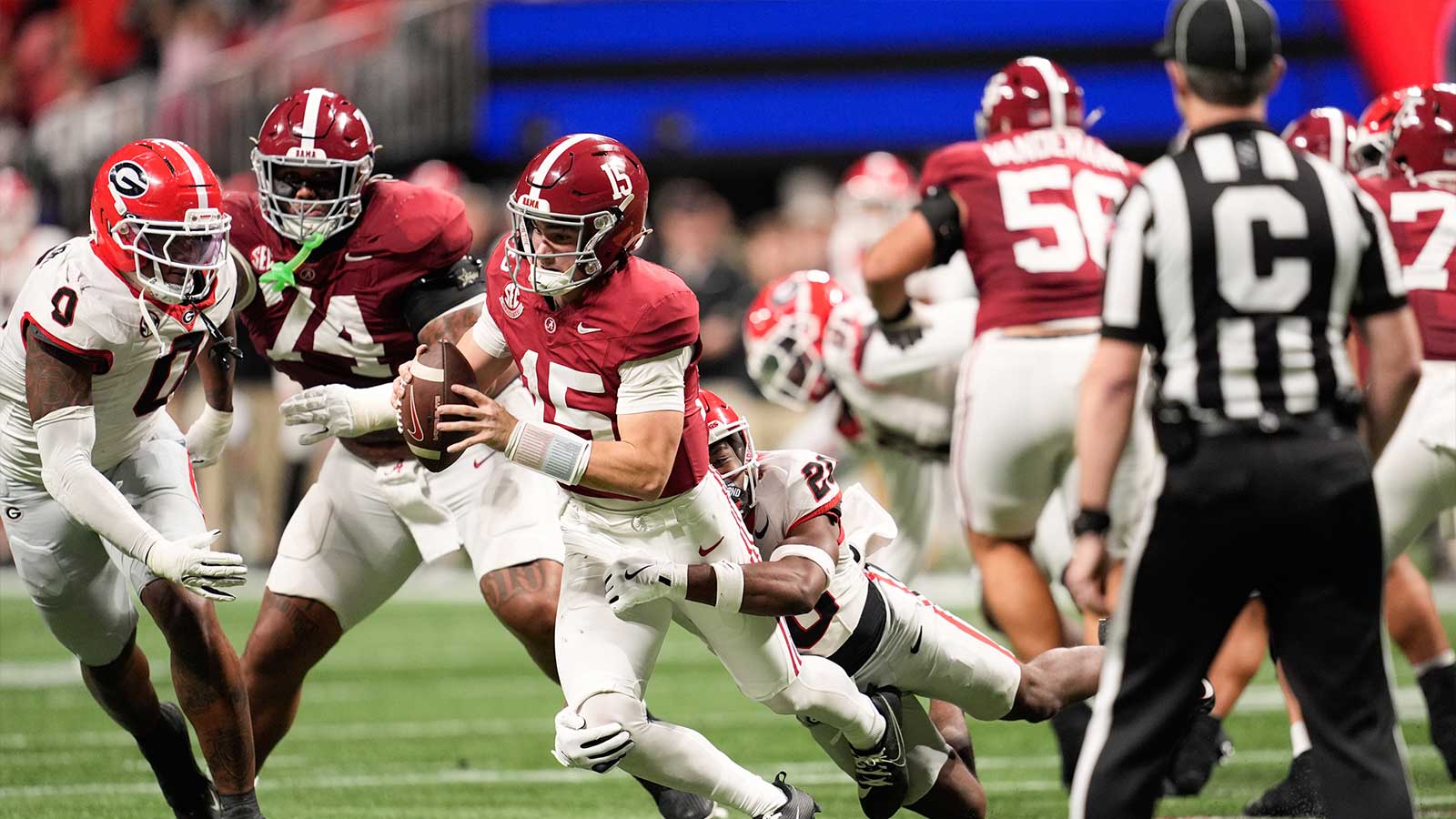Alabama Crimson Tide quarterback Ty Simpson (15) is sacked by Georgia Bulldogs defensive back Jacorey Thomas (20) during the third quarter during the 2025 SEC Championship game at Mercedes-Benz Stadium. 