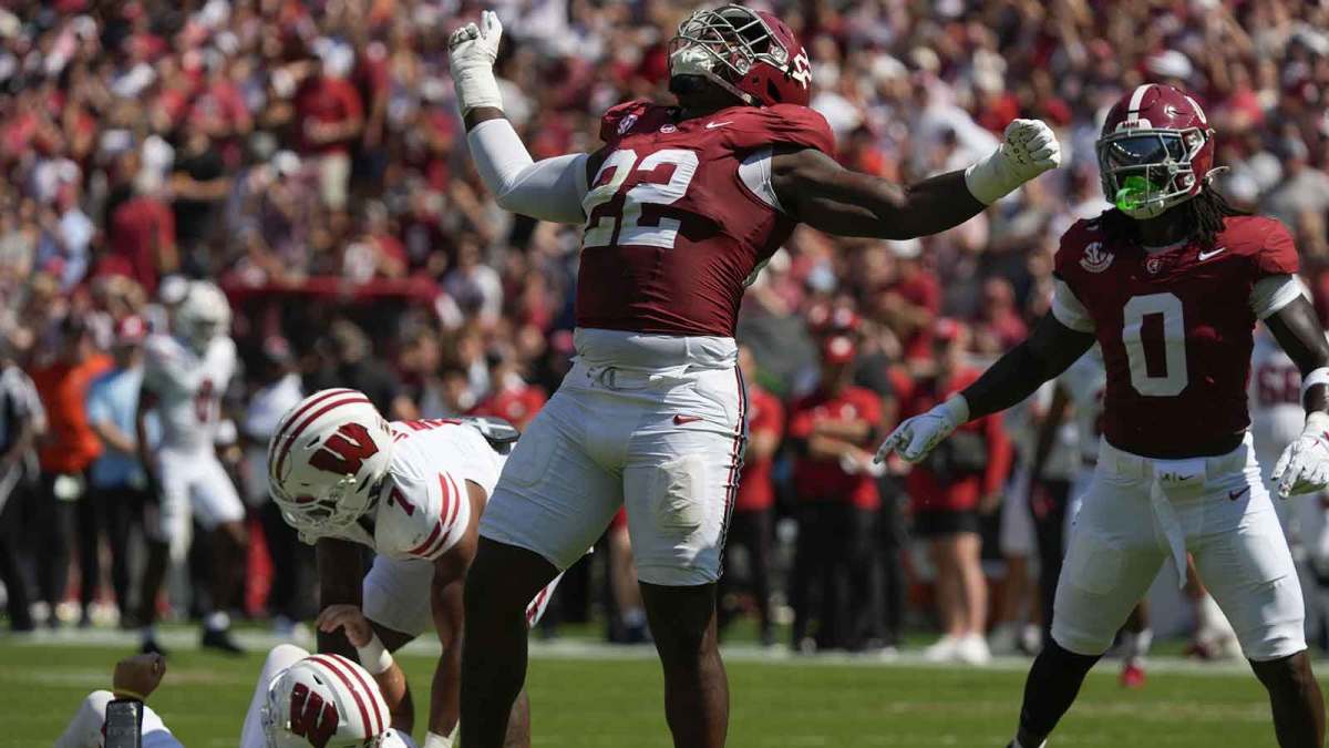 Alabama defensive lineman LT Overton (22) celebrates after sacking Wisconsin quarterback Danny O'Neil (18) at Saban Field at Bryant-Denny Stadium.