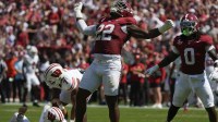 Alabama defensive lineman LT Overton (22) celebrates after sacking Wisconsin quarterback Danny O'Neil (18) at Saban Field at Bryant-Denny Stadium.