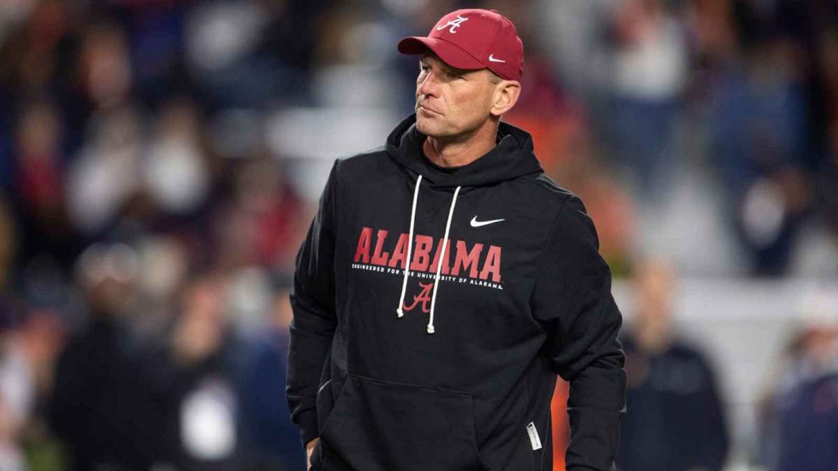 Alabama Crimson Tide head coach Kalen DeBoer watches on during warm ups before Auburn Tigers take on Alabama Crimson Tide