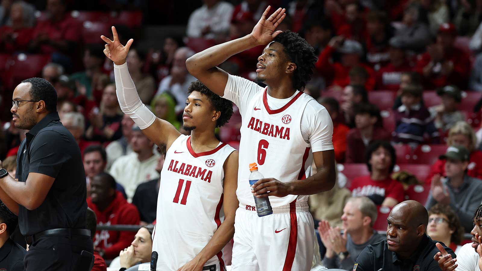 Alabama Crimson Tide guard Preston Murphy Jr. (11) and Alabama Crimson Tide forward London Jemison (6) react after a three pointer during the first half against the UTSA Roadrunners at Coleman Coliseum.