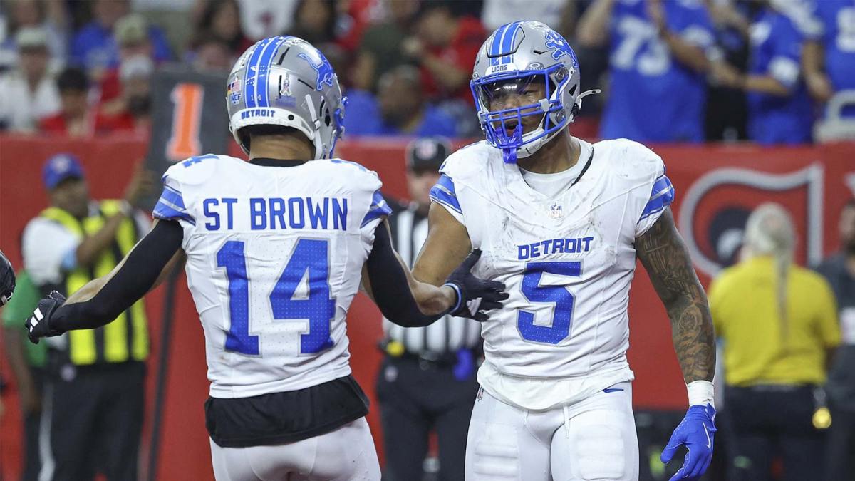 Detroit Lions running back David Montgomery (5) celebrates with wide receiver Amon-Ra St. Brown (14) after scoring a touchdown during the third quarter against the Houston Texans at NRG Stadium.