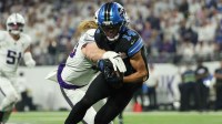 Minnesota Vikings linebacker Andrew van Ginkel (43) tackles Detroit Lions wide receiver Amon-Ra St. Brown (14) after a reception in the second quarter at U.S. Bank Stadium.