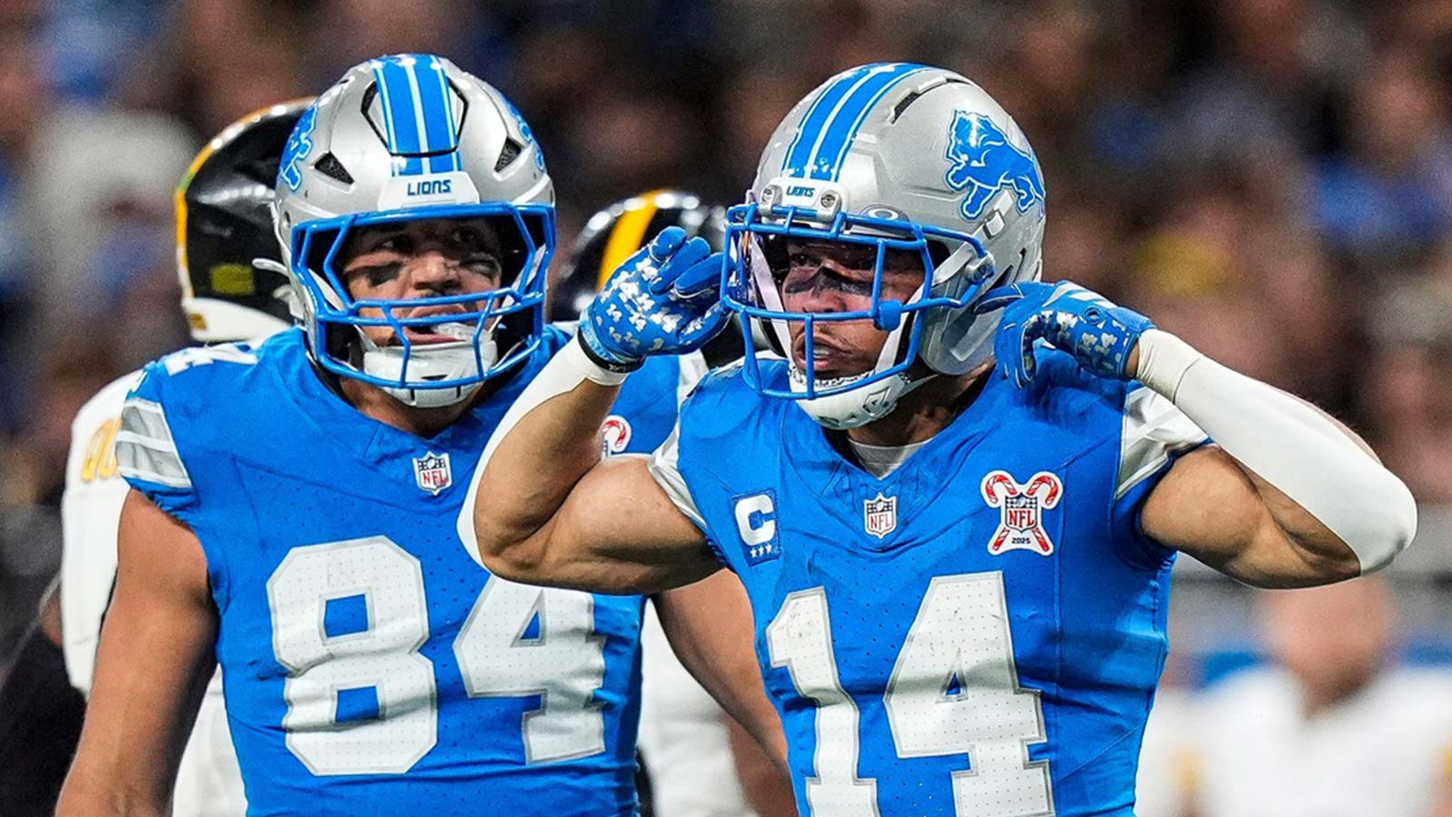 Detroit Lions wide receiver Amon-Ra St. Brown (14) celebrates a first down against Pittsburgh Steelers during the first half at Ford Field in Detroit on Sunday, Dec. 21, 2025.