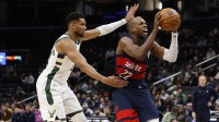 Washington Wizards forward Khris Middleton (22) drives to the basket past Milwaukee Bucks forward Giannis Antetokounmpo (34) in the second half at Capital One Arena.