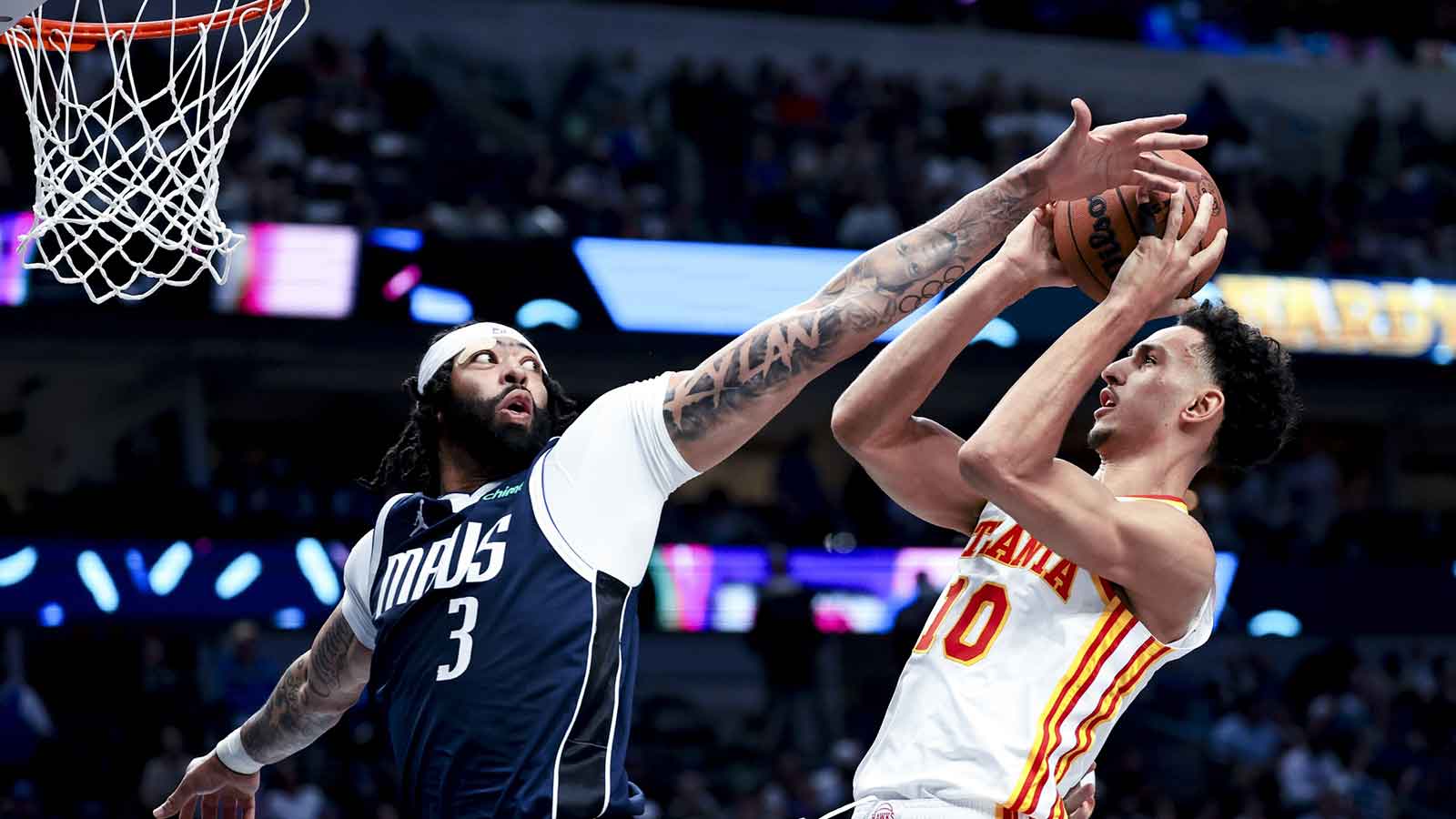 Dallas Mavericks forward Anthony Davis (3) defends the shot of Atlanta Hawks forward Zaccharie Risacher (10)) during the third quarter at American Airlines Center. 