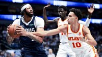 Dallas Mavericks forward Anthony Davis (3) looks to pass around Atlanta Hawks forward Zaccharie Risacher (10) during the third quarter at American Airlines Center.