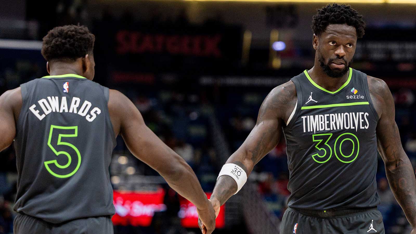 Minnesota Timberwolves forward/center Julius Randle (30) claps hands with guard Anthony Edwards (5) after a play against the New Orleans Pelicans during the second half at Smoothie King Center.