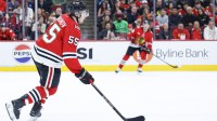 Chicago Blackhawks defenseman Artyom Levshunov (55) looks to pass the puck against the Calgary Flames during the second period at United Center.