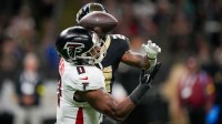 Atlanta Falcons linebacker Divine Deablo (0) breaks up the pass to New Orleans Saints running back Devin Neal (24) during the second half at Caesars Superdome.