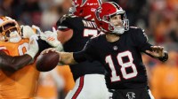 Atlanta Falcons quarterback Kirk Cousins (18) throws a pass and offensive tackle Jake Matthews (70) blocks against Tampa Bay Buccaneers linebacker Yaya Diaby (0) during the second quarter at Raymond James Stadium.