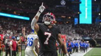 Atlanta Falcons running back Bijan Robinson (7) reacts after catching a touchdown pass against the Los Angeles Rams during the first quarter at Mercedes-Benz Stadium.