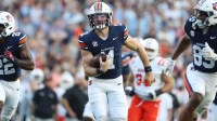 Auburn Tigers quarterback Jackson Arnold (11) runs for a touchdown in the fourth quarter against the Mercer Bears at Jordan-Hare Stadium.
