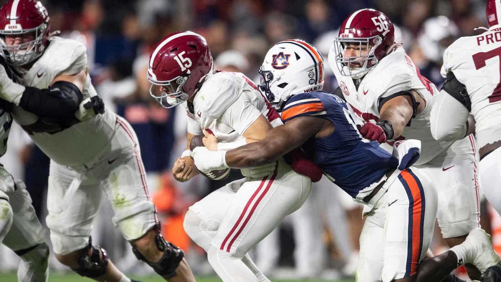 Auburn Tigers linebacker Xavier Atkins (17) sacks Alabama Crimson Tide quarterback Ty Simpson (15) as Auburn Tigers take on Alabama Crimson Tide in the Iron Bowl at Jordan-Hare Stadium in Auburn, Ala. on Saturday, Nov. 29, 2025. Alabama Crimson Tide leads Auburn Tigers 17-6.