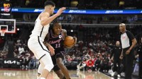 Dec 3, 2025; Chicago, Illinois, USA; Chicago Bulls guard Ayo Dosunmu (11) drives against Brooklyn Nets forward Michael Porter Jr. (17) during the first half at the United Center. Mandatory Credit: Matt Marton-Imagn Images