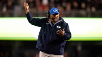 BYU Cougars head coach Kalani Sitake coaches in the fourth quarter of the NCAA football game between the Cincinnati Bearcats and BYU Cougars at Nippert Stadium in Cincinnati on Nov. 22, 2025.