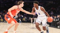 BYU Cougars forward AJ Dybantsa (3) looks to drive past Clemson Tigers forward Jake Wahlin (10) in the first half at Madison Square Garden.