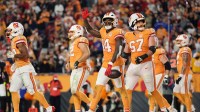 Tampa Bay Buccaneers wide receiver Chris Godwin Jr. (14) acknowledges the crowd with teammates after catching a three-yard touchdown pass thrown by quarterback Baker Mayfield (not pictured) against the Atlanta Falcons during the fourth quarter at Raymond James Stadium.
