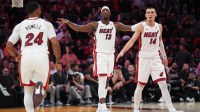 Miami Heat center Bam Adebayo (13), guard Norman Powell (24) and guard Tyler Herro (14) get back on defense against the Los Angeles Clippers during the second half at Kaseya Center.