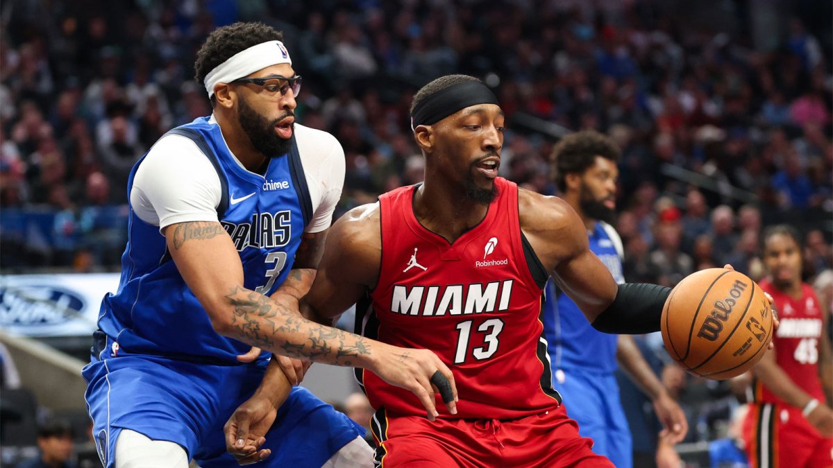 Miami Heat center Bam Adebayo (13) controls the ball as Dallas Mavericks forward Anthony Davis (3) defends during the second half at American Airlines Center.