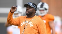 Defensive coordinator Tim Banks coaches players during a drill during Tennessee Football s first fall practice, Wednesday, Aug. 2, 2023.