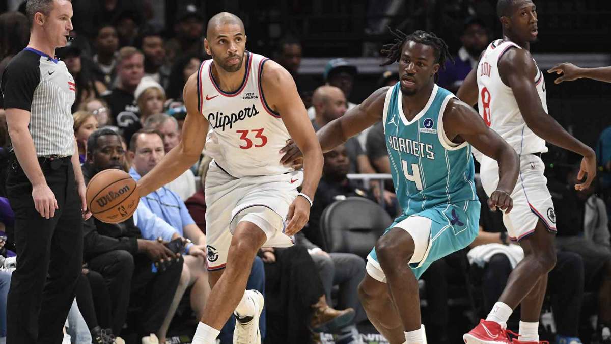 Los Angeles Clippers forward Nicolas Batum (33) drives past Charlotte Hornets guard Sion James (4) during the first half at the Spectrum Center.