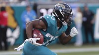 Jacksonville Jaguars running back Bhayshul Tuten (33) returns a kick during the third quarter against the New York Jets at EverBank Stadium.