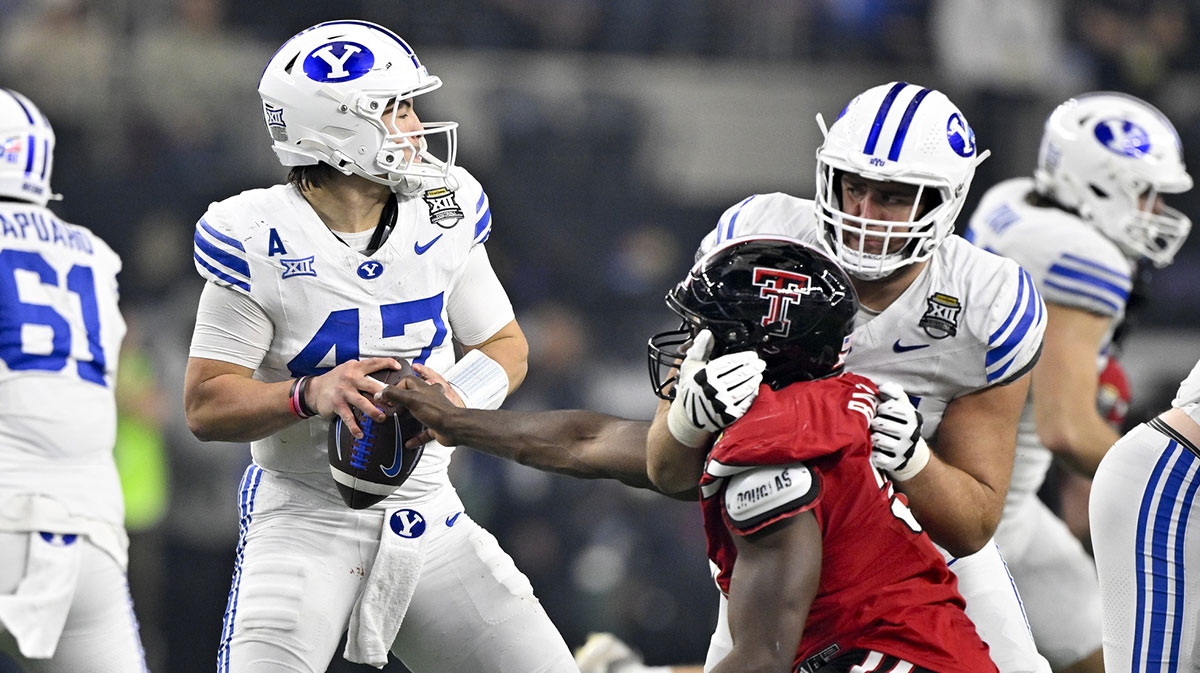 Texas Tech Red Raiders defensive back Miquel Dingle Jr. (21) strips the ball away from BYU Cougars quarterback Bear Bachmeier (47) during the second half at AT&T Stadium.