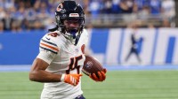 Chicago Bears wide receiver Rome Odunze (15) carries the ball for a touchdown against the Detroit Lions during the first quarter at Ford Field.