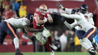 Chicago Bears defensive tackle Gervon Dexter Sr. (99) tackles San Francisco 49ers running back Christian McCaffrey (23) in the second half at Levi's Stadium.