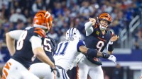 Cincinnati Bengals quarterback Joe Burrow (9) throws as Dallas Cowboys linebacker Micah Parsons (11) defends during the second half at AT&T Stadium.