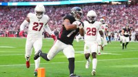 Atlanta Falcons running back Bijan Robinson (7) runs after the catch for a touchdown as Arizona Cardinals linebacker Akeem Davis-Gaither (27) and cornerback Denzel Burke (29) trail on the play during the first half at State Farm Stadium.