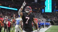 Atlanta Falcons running back Bijan Robinson (7) reacts after catching a touchdown pass against the Los Angeles Rams during the first quarter at Mercedes-Benz Stadium.