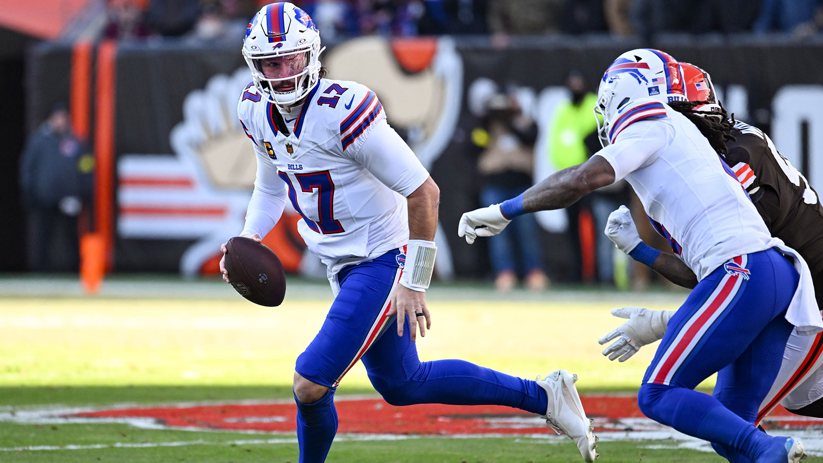 Buffalo Bills quarterback Josh Allen (17) rolls out against the Cleveland Browns during the first half at Huntington Bank Field.