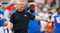 Florida Gators head coach Billy Napier gestures before a game against the Texas Longhorns at Ben Hill Griffin Stadium.