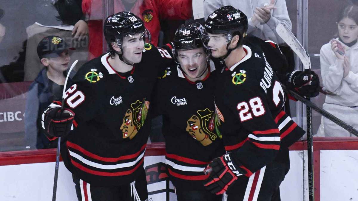 Chicago Blackhawks center Connor Bedard (98) celebrates with center Ryan Greene (20) and left wing Andre Burakovsky (28) after he scores a goal against the Anaheim Ducks during the third period at United Center.