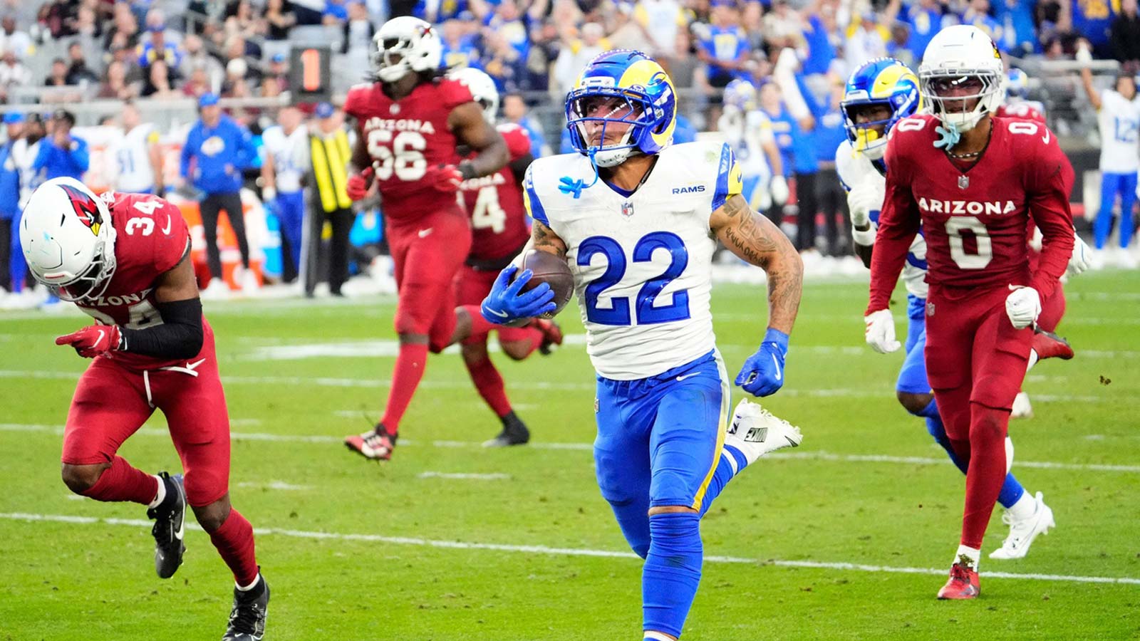 Los Angeles Rams running back Blake Corum (22) runs for a touchdown against the Arizona Cardinals in the second half at State Farm Stadium on Dec 7, 2025, in Glendale, Ariz.