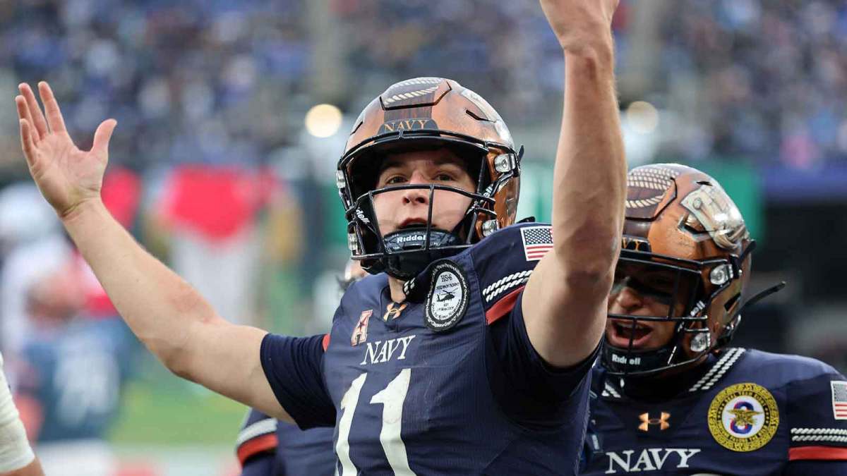 Navy Midshipmen quarterback Blake Horvath (11) reacts after scoring a touchdown against the Army Black Knights during the first half at M&T Bank Stadium.