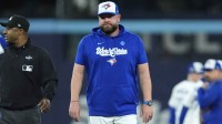 Toronto Blue Jays manager John Schneider (14) reacts after the benches clear in the fourth inning against the Los Angeles Dodgers during game seven of the 2025 MLB World Series at Rogers Centre.