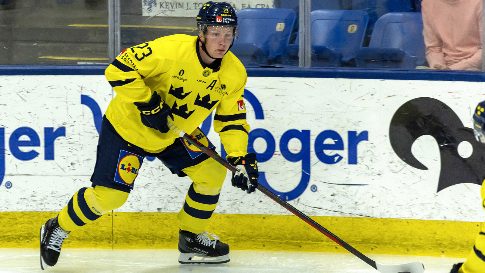 Sweden's forward Otto Stenberg (23) controls the puck against USA during the second period of the 2024 World Junior Summer Showcase at USA Hockey Arena.