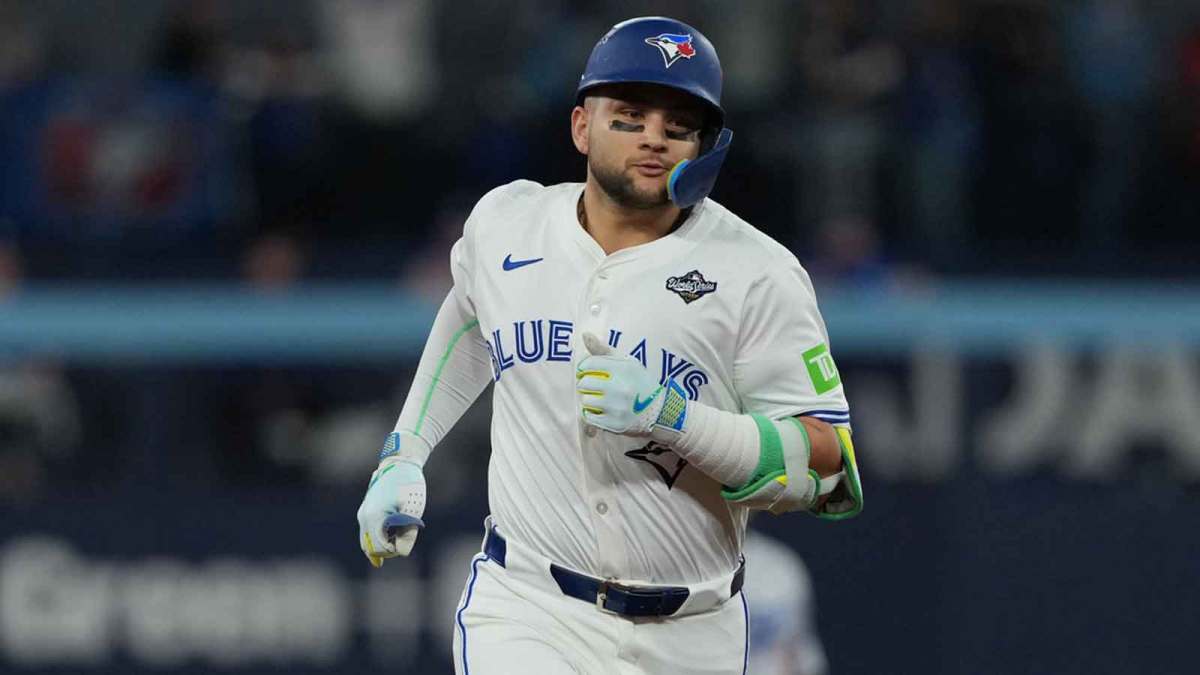 Toronto Blue Jays shortstop Bo Bichette (11) rounds the bases after hitting a three run home run against the Los Angeles Dodgers in the third inning for game seven of the 2025 MLB World Series at Rogers Centre.