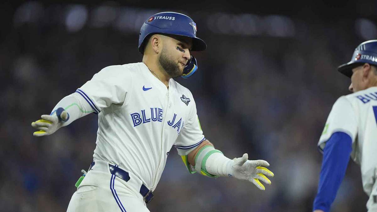 Toronto Blue Jays designated hitter Bo Bichette (11) reacts as he runs the bases after hitting a three run home run against the Los Angeles Dodgers in the third inning during game seven of the 2025 MLB World Series at Rogers Centre.