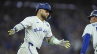 Toronto Blue Jays designated hitter Bo Bichette (11) reacts as he runs the bases after hitting a three run home run against the Los Angeles Dodgers in the third inning during game seven of the 2025 MLB World Series at Rogers Centre.