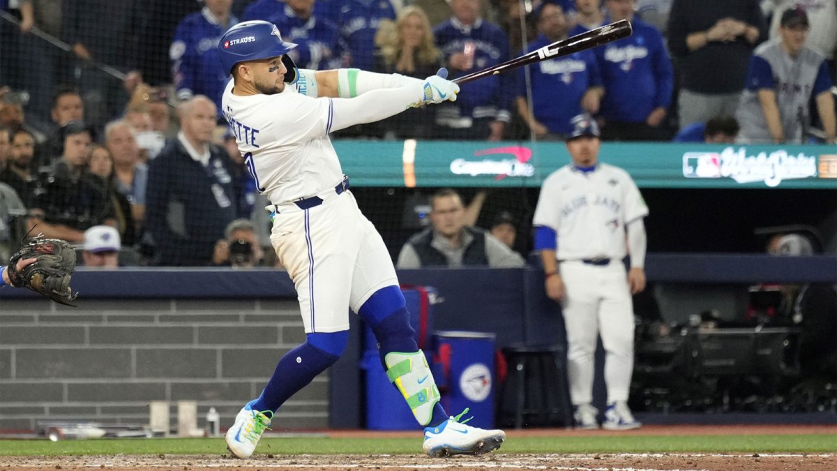 Toronto Blue Jays designated hitter Bo Bichette (11) hits a single against the Los Angeles Dodgers in the ninth inning during game seven of the 2025 MLB World Series at Rogers Centre.
