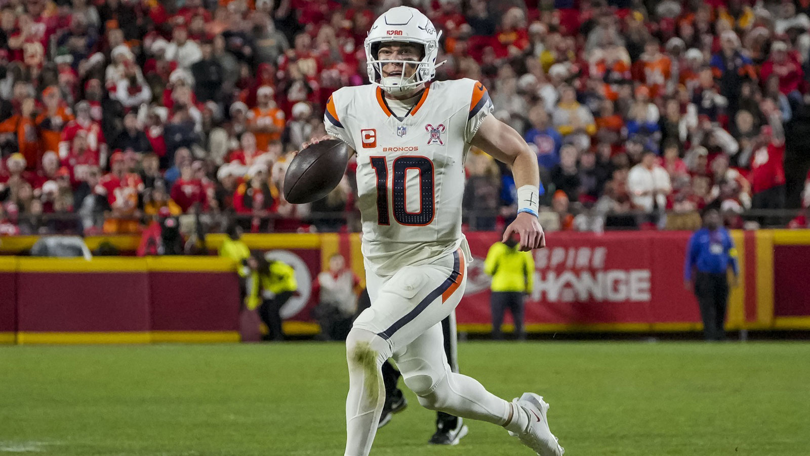Denver Broncos quarterback Bo Nix (10) runs the ball during the third quarter at GEHA Field at Arrowhead Stadium.