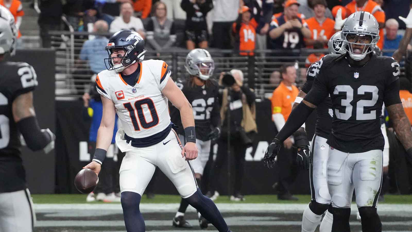 Denver Broncos quarterback Bo Nix (10) reacts after scoring a touchdown against the Las Vegas Raiders during the first half at Allegiant Stadium.