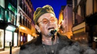 U2 singer Bono in front of Grafton Street in Dublin, Ireland, where the annual Christmas Eve busking takes place.
