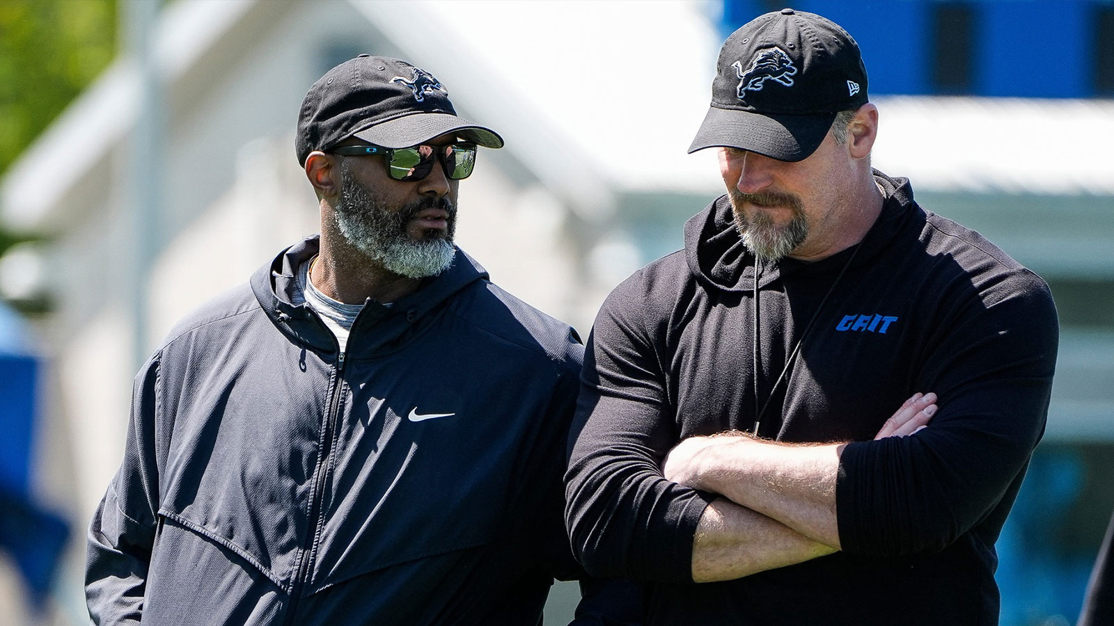 Detroit Lions general manager Brad Holmes, left, talks to coach Dan Campbell as they walk off the field after practice during rookie minicamp at the Lions' Meijer Performance Center in Allen Park on Friday, May 9, 2025.
