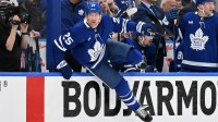 Toronto Maple Leafs defenseman Brandon Carlo (25) vaults the boards as he changes on the fly against the Ottawa Senators in the second period in game two of the first round of the 2025 Stanley Cup Playoffs at Scotiabank Arena.
